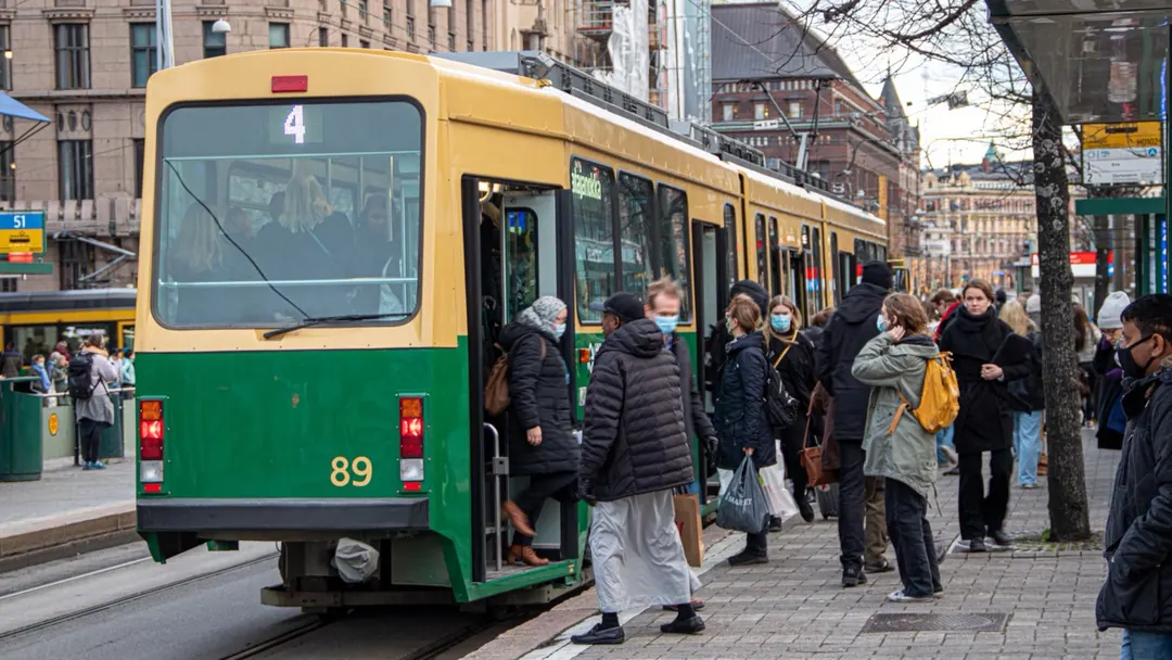 Passengers boarding a heritage tram in central Helsinki