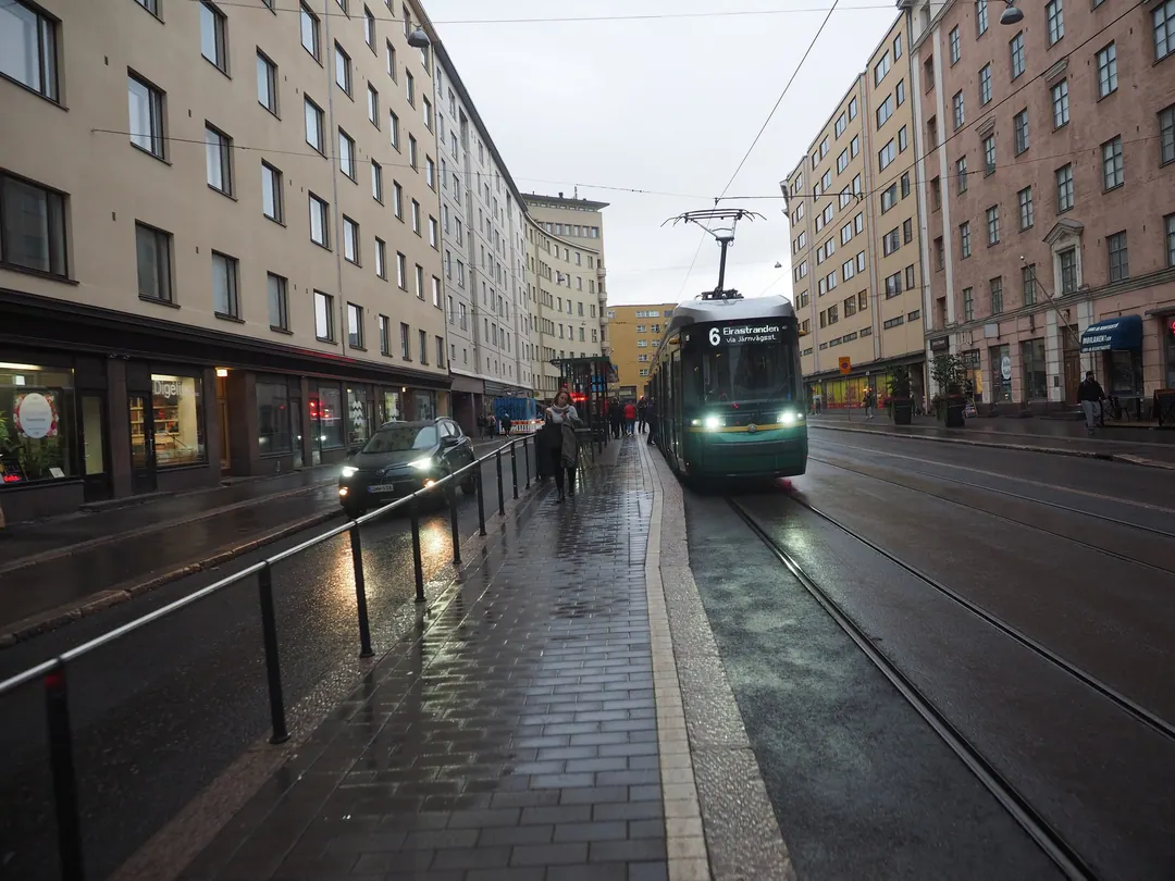 A tram stop on Hämeentie in Helsinki on a rainy September evening