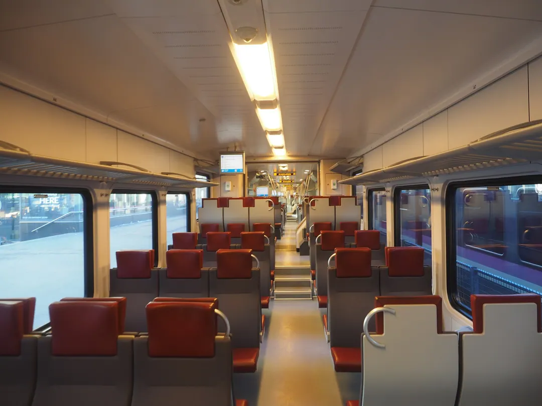 The interior of an HSL commuter train in Helsinki, empty of people on a March morning