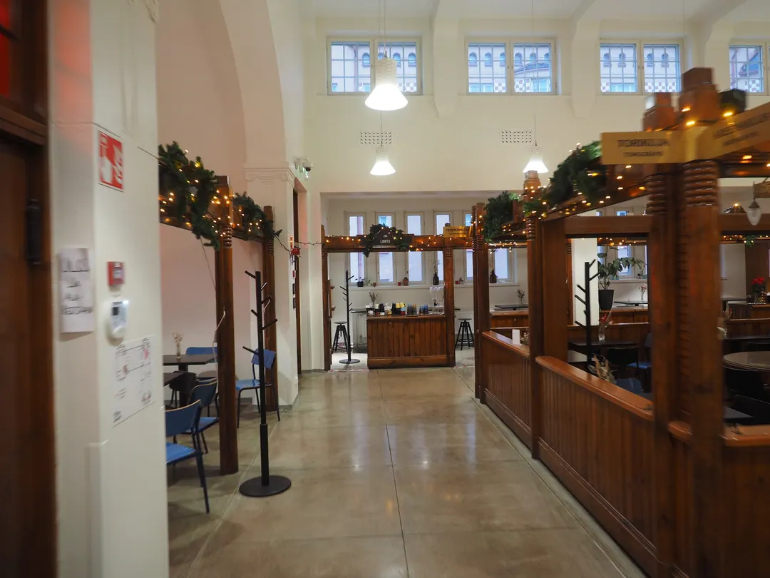 The interior of Hakaniemi Market Hall on Christmas Eve, stalls shuttered and the aisle empty