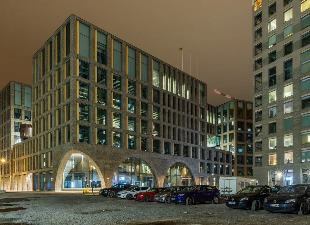 The Kaupunkiympäristötalo office building in Kalasatama, Helsinki, glass and dark cladding under a grey sky