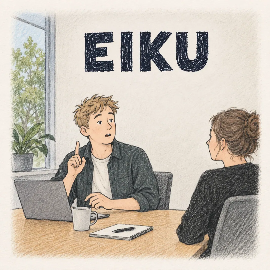 eiku - a young man in an office meeting stopping mid-sentence with one finger raised to correct himself