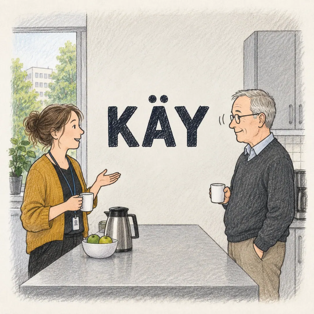 käy - two colleagues either side of an office kitchen counter, one having proposed a time and the other nodding once
