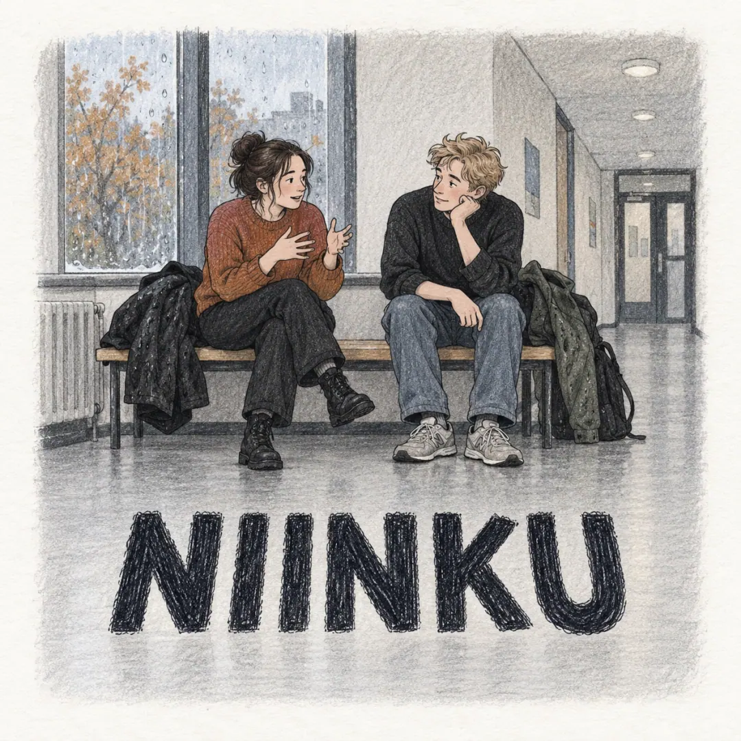 niinku - two students on a university corridor bench, one talking with both hands while the other listens, wet coats beside them